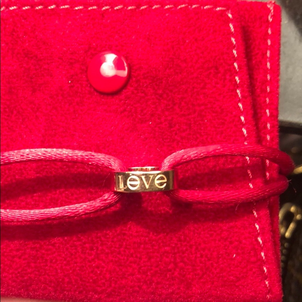 Cartier 18 k rose gold bracelet black and red cord